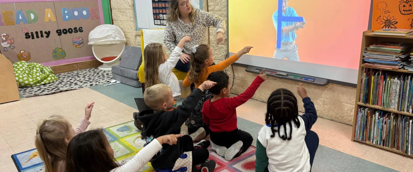 Photo of children learning letters.