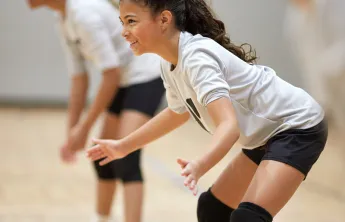 Child playing volleyball. 